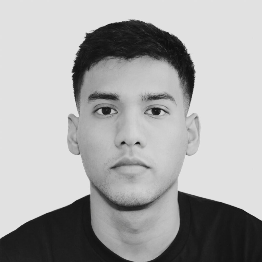 A black and white photo of a man in a black shirt